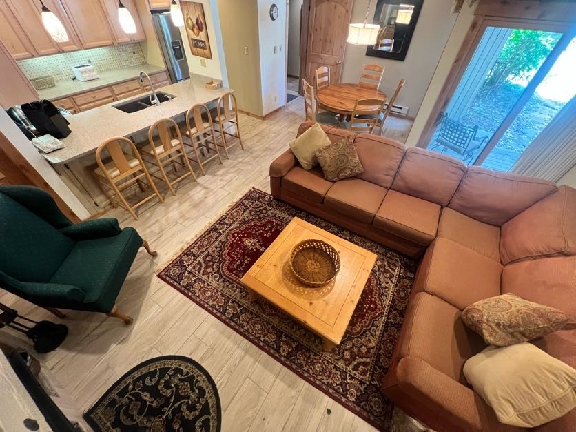 a couch sitting in a living room with a rug