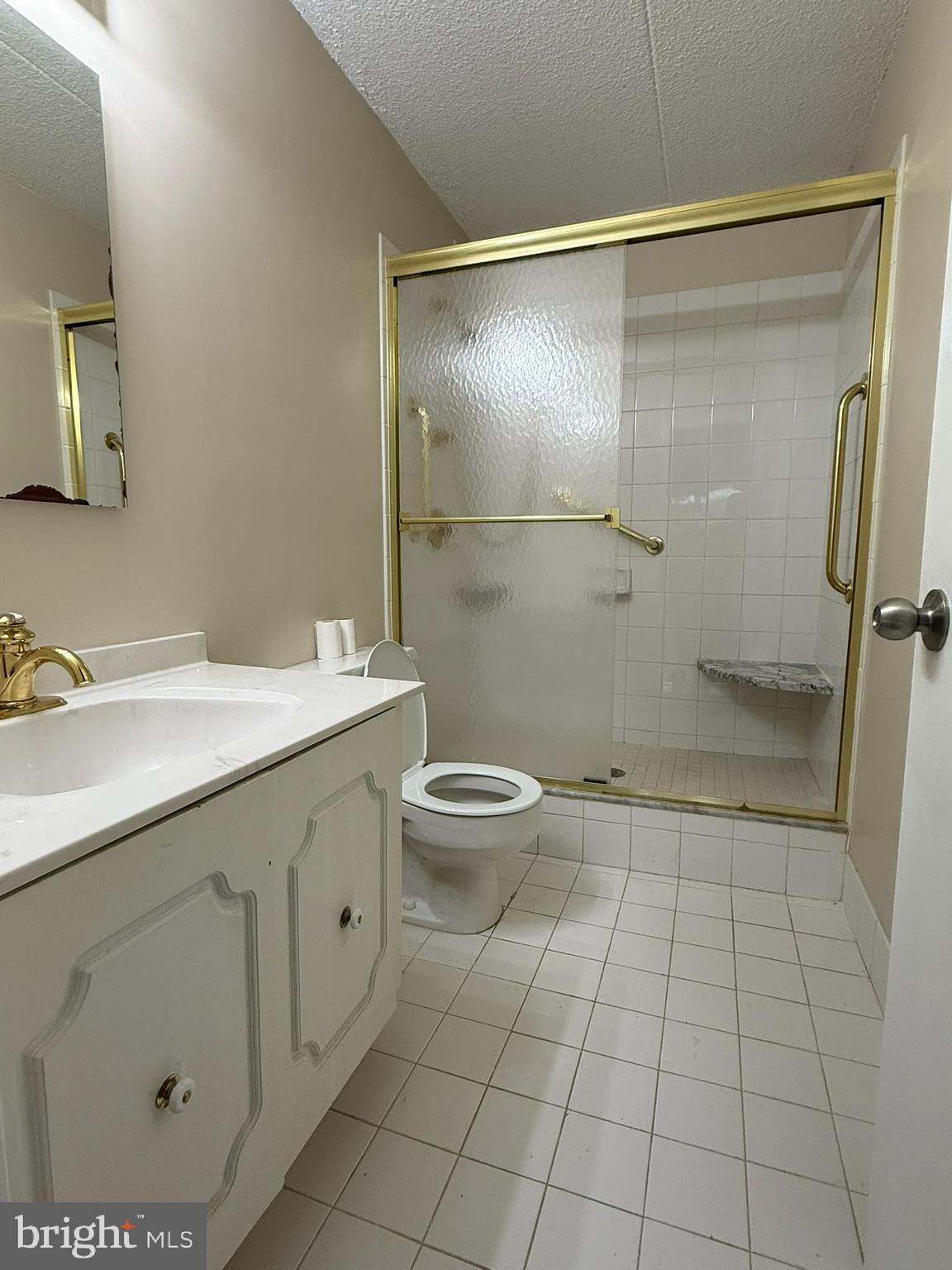860 Lower Ferry Road, Unit 2K Ewing, NJ 08628 - Photo 3 of 14 a bathroom with a double vanity sink toilet and shower