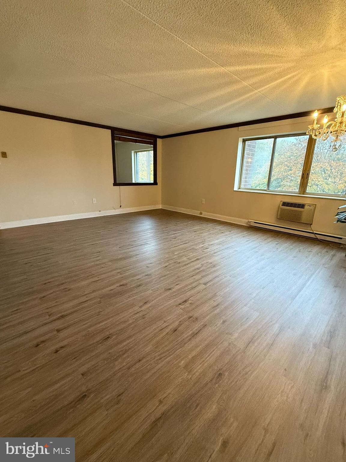 860 Lower Ferry Road, Unit 2K Ewing, NJ 08628 - Photo 6 of 14 wooden floor in an empty room