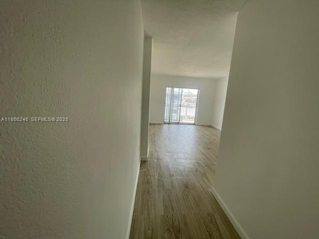 1735 Northeast 164th Street, Unit F204 North Miami Beach, FL 33162 - Photo 12 of 25 a view of wooden floor