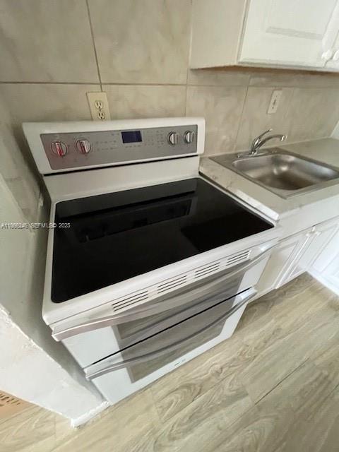 1735 Northeast 164th Street, Unit F204 North Miami Beach, FL 33162 - Photo 18 of 25 a stove top oven sitting inside of a kitchen