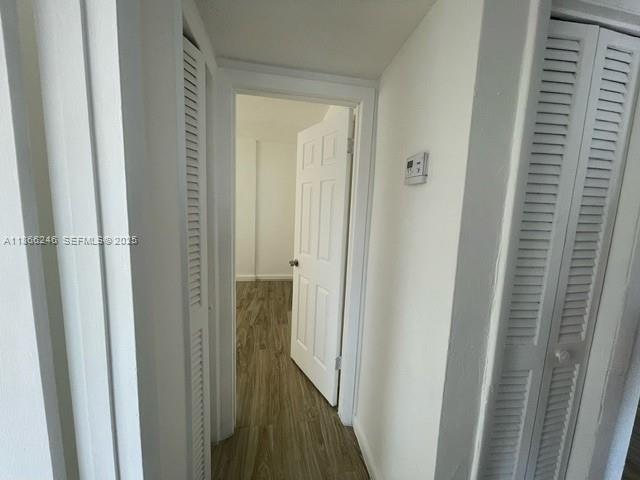 1735 Northeast 164th Street, Unit F204 North Miami Beach, FL 33162 - Photo 21 of 25 a view of a hallway