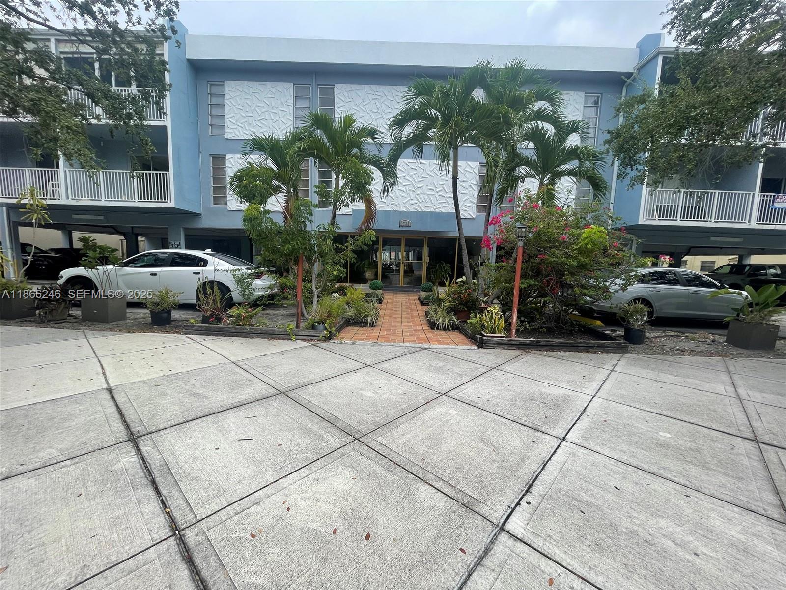 1735 Northeast 164th Street, Unit F204 North Miami Beach, FL 33162 - Photo 22 of 25 a car parked in front of a building