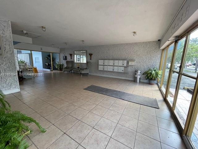 1735 Northeast 164th Street, Unit F204 North Miami Beach, FL 33162 - Photo 23 of 25 a view of a livingroom with furniture and a gate