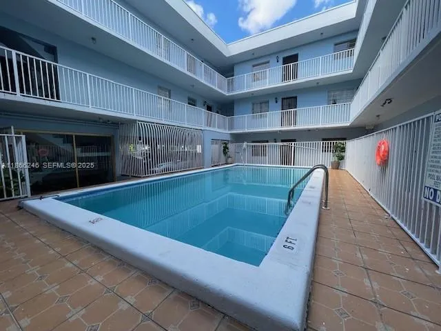 a view of a balcony with seating space