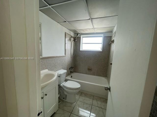 1735 Northeast 164th Street, Unit F204 North Miami Beach, FL 33162 - Photo 6 of 25 a bathroom with a toilet a sink and shower