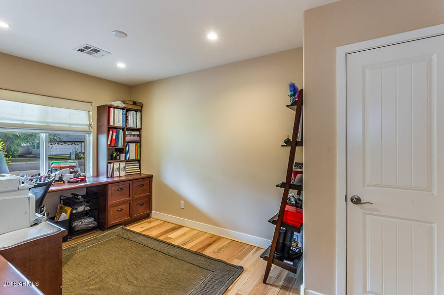 130 East Lawrence Road Phoenix, AZ 85012 - Photo 11 of 18 a room with furniture and a window