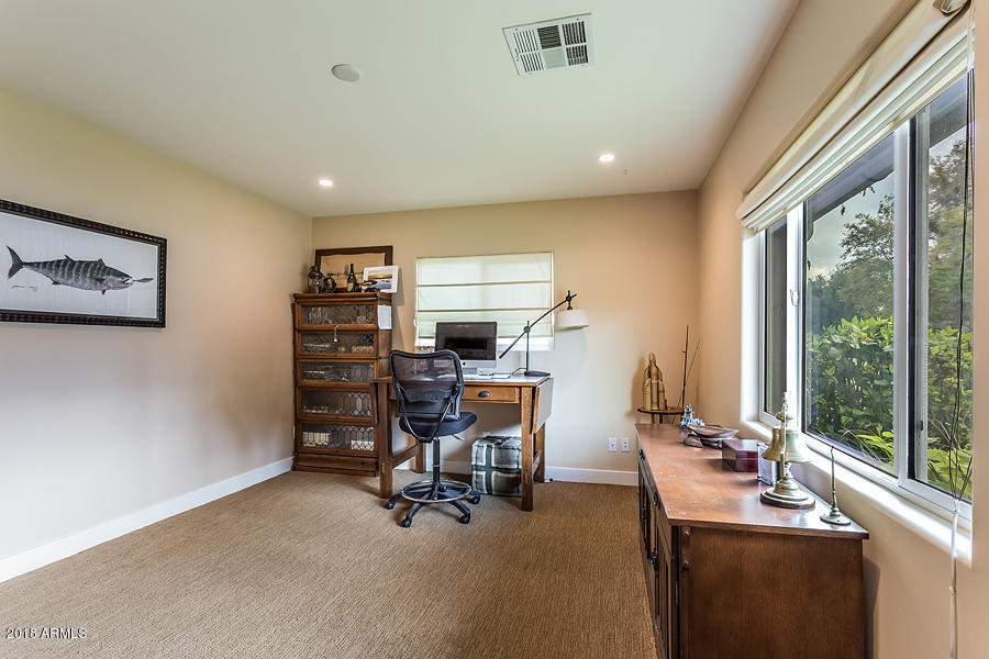 130 East Lawrence Road Phoenix, AZ 85012 - Photo 12 of 18 a view of a workspace with furniture and a window