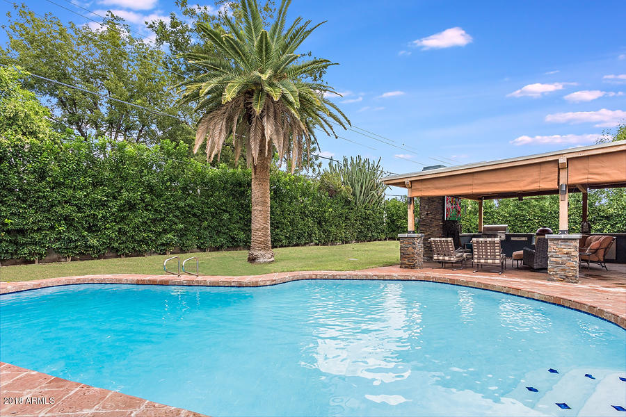 130 East Lawrence Road Phoenix, AZ 85012 - Photo 17 of 18 a view of a swimming pool with a patio