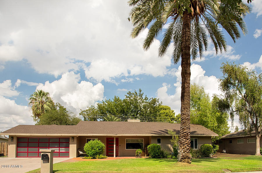 130 East Lawrence Road Phoenix, AZ 85012 - Photo 18 of 18 a front view of a house with garden