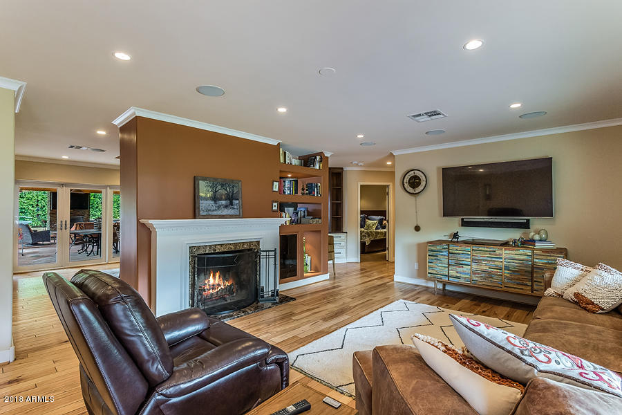 130 East Lawrence Road Phoenix, AZ 85012 - Photo 3 of 18 a living room with furniture and a fireplace