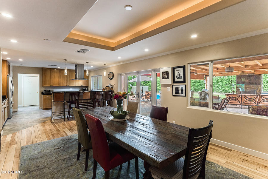 130 East Lawrence Road Phoenix, AZ 85012 - Photo 5 of 18 a dining room with furniture window and wooden floor