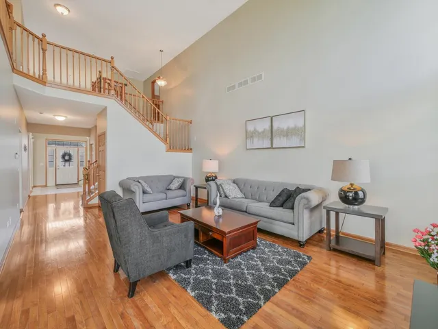 a living room with furniture and kitchen view