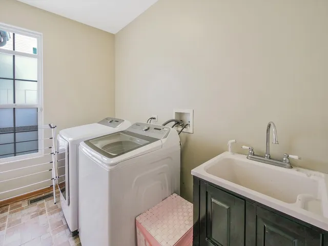 a view of entryway with wooden floor and stairs