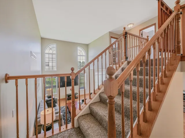 a view of a bedroom with baby crib and toys