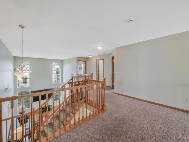 a bathroom with a granite countertop sink a toilet a mirror and shower