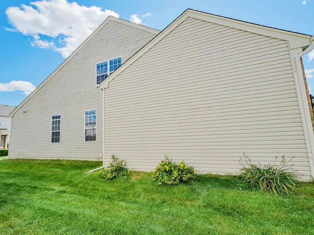 a hallway with potted plants in front of it