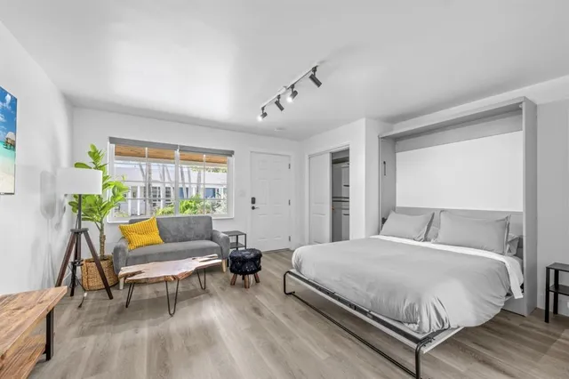 a bedroom with a bed and a couch