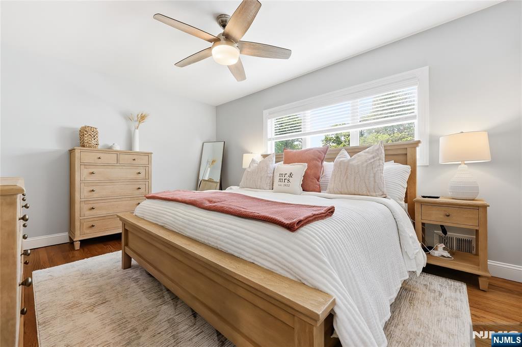 77 White Pond Road Waldwick, NJ 07463 - Photo 13 of 33 a bedroom with a bed and a chandelier