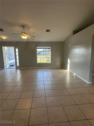 a view of an empty room and window