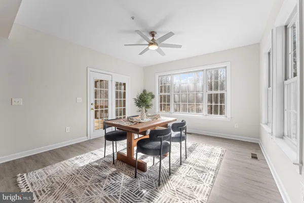 a view of room with window and wooden floor