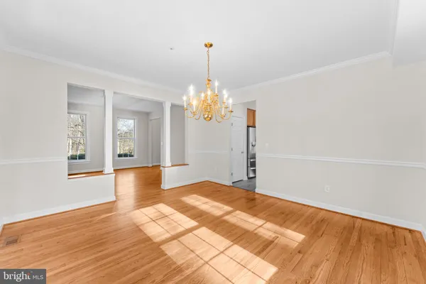a living room with furniture and a ceiling fan