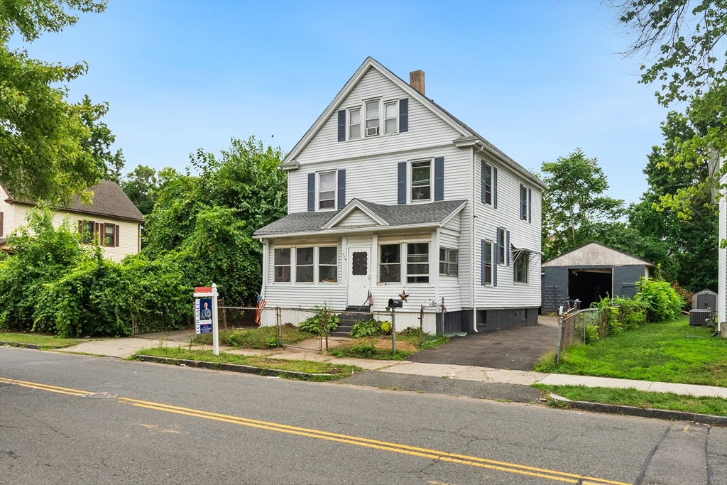 234 Allen Street Springfield, MA 01108 - Photo 1 of 14 a front view of a house with a yard