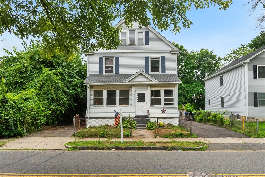 234 Allen Street Springfield, MA 01108 - Photo 2 of 14 a front view of a house with a yard and potted plants