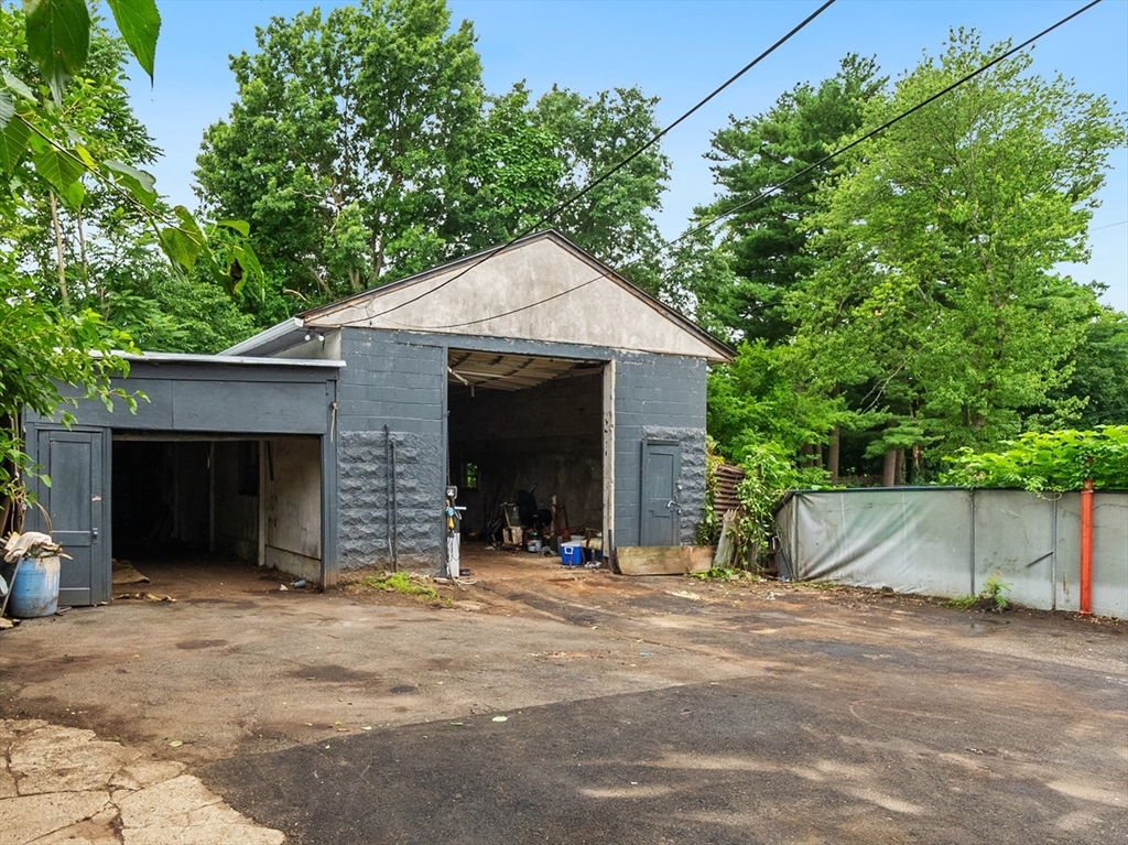 234 Allen Street Springfield, MA 01108 - Photo 10 of 14 a view of a house with a yard and garage