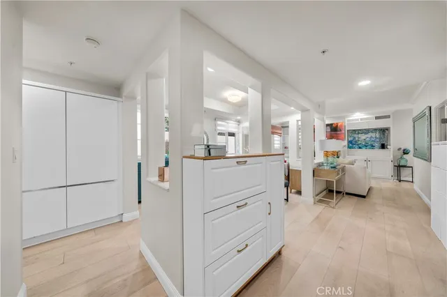 a view of a dining room with furniture and a window