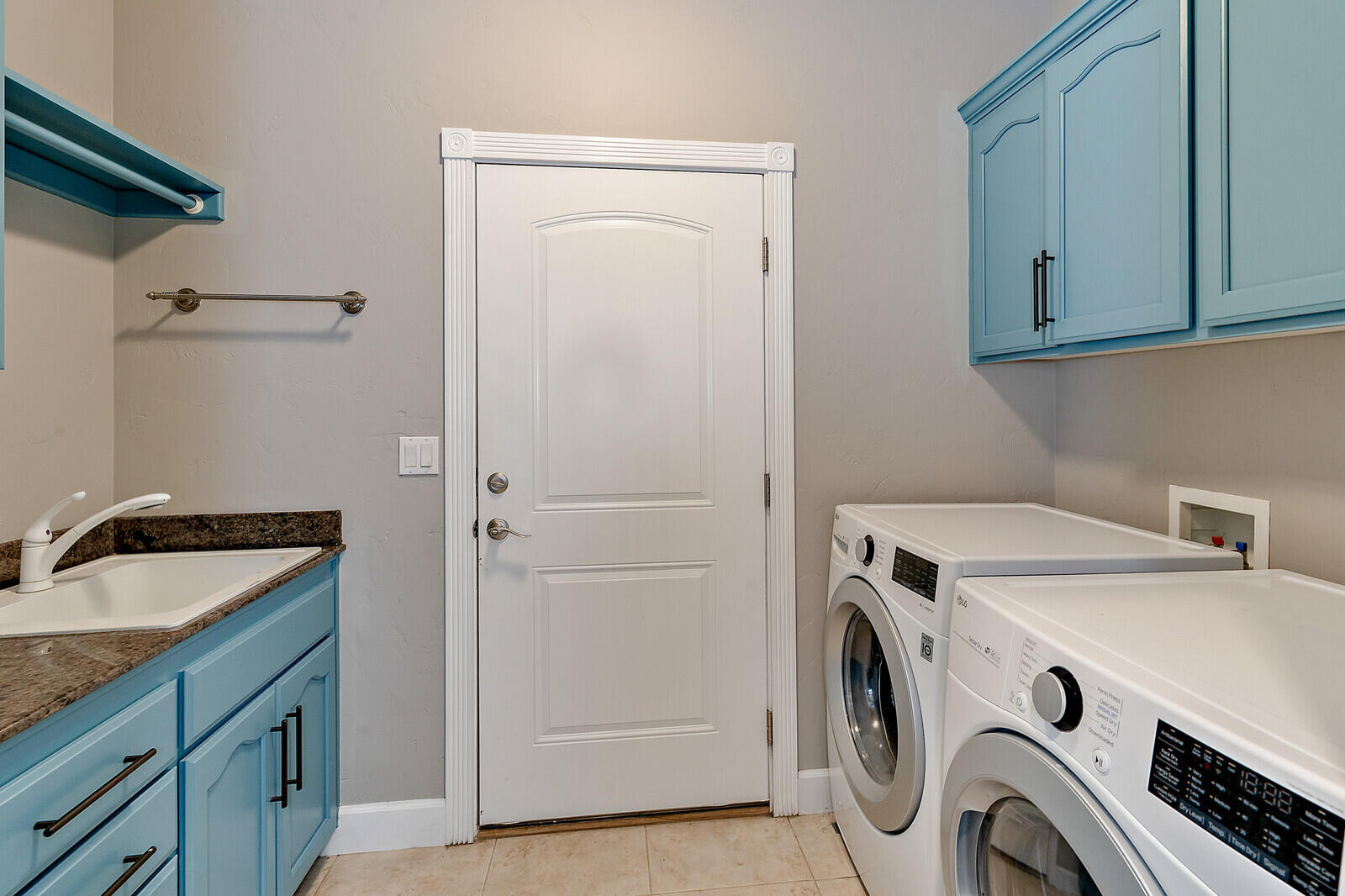 315 Summit Loop Grants Pass, OR 97527 - Photo 13 of 48 Washer & Dryer included! Mud sink, counter, clothes rod, cabinets and door leads to 3 car garage!