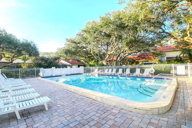 a view of a swimming pool with a patio