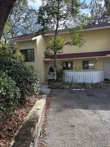 a house view with a sitting space and garden space
