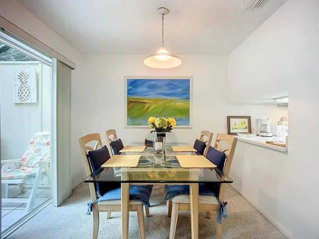 a dining room with furniture and window