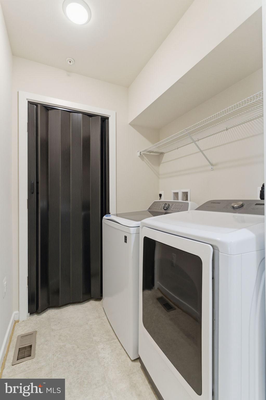 169 Kandinsky Loop Silver Spring, MD 20906 - Photo 55 of 67 Efficient laundry space with modern appliances.