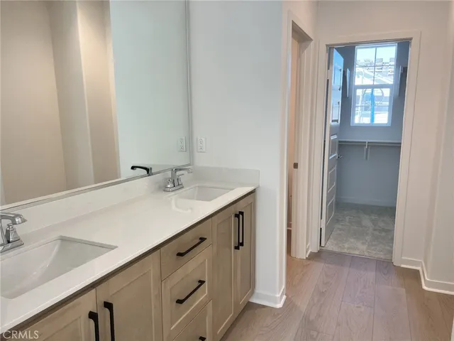 a bathroom with a sink a mirror and a shower