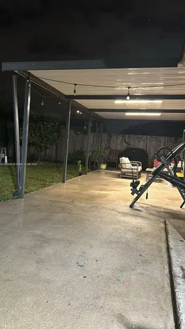 a view of a garage with wooden floor