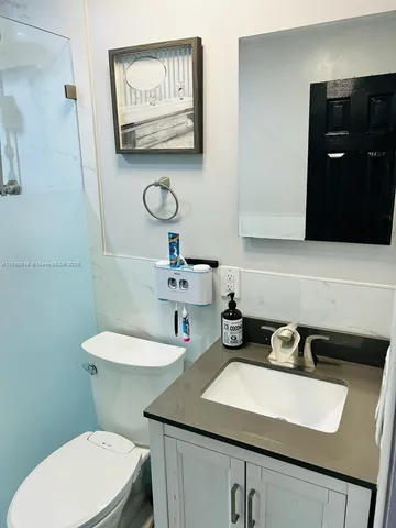a bathroom with a sink and a toilet