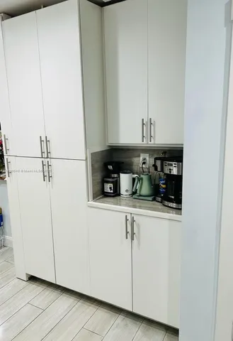 a kitchen with appliances and cabinets