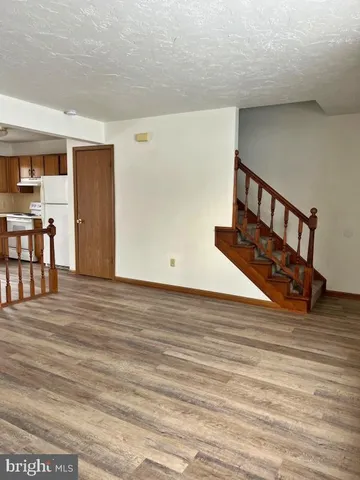 a view of wooden floor with furniture