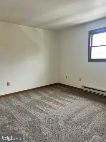 a view of a room that has window