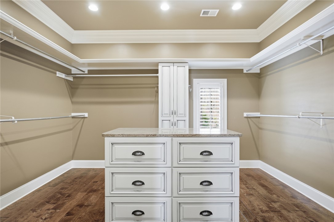 610 Highridge Drive Seneca, SC 29672 - Photo 31 of 50 This spacious closet features ample storage solutions and warm wood flooring.