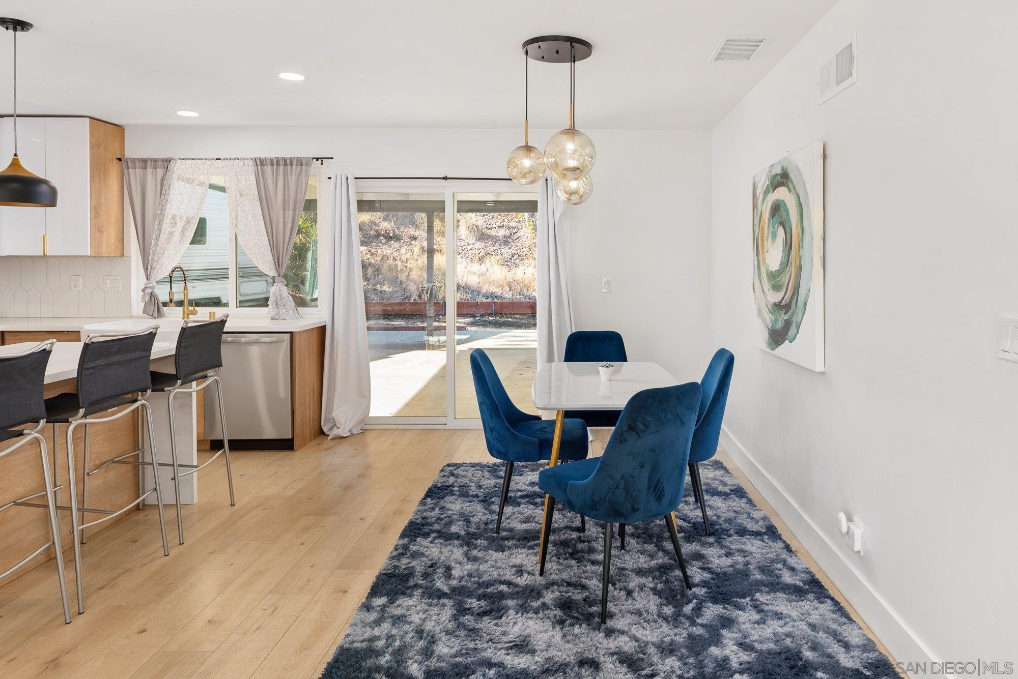 7942 Calico Street San Diego, CA 92126 - Photo 11 of 39 a view of a dining room with furniture window and outside view