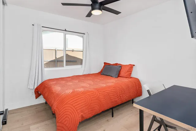 a bedroom with a bed and window