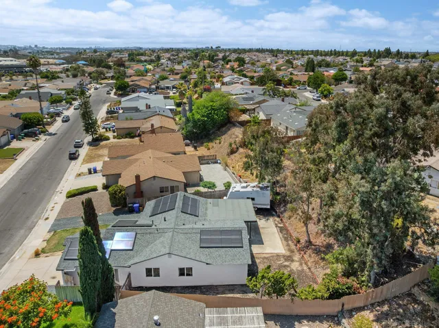 an aerial view of residential houses with outdoor space