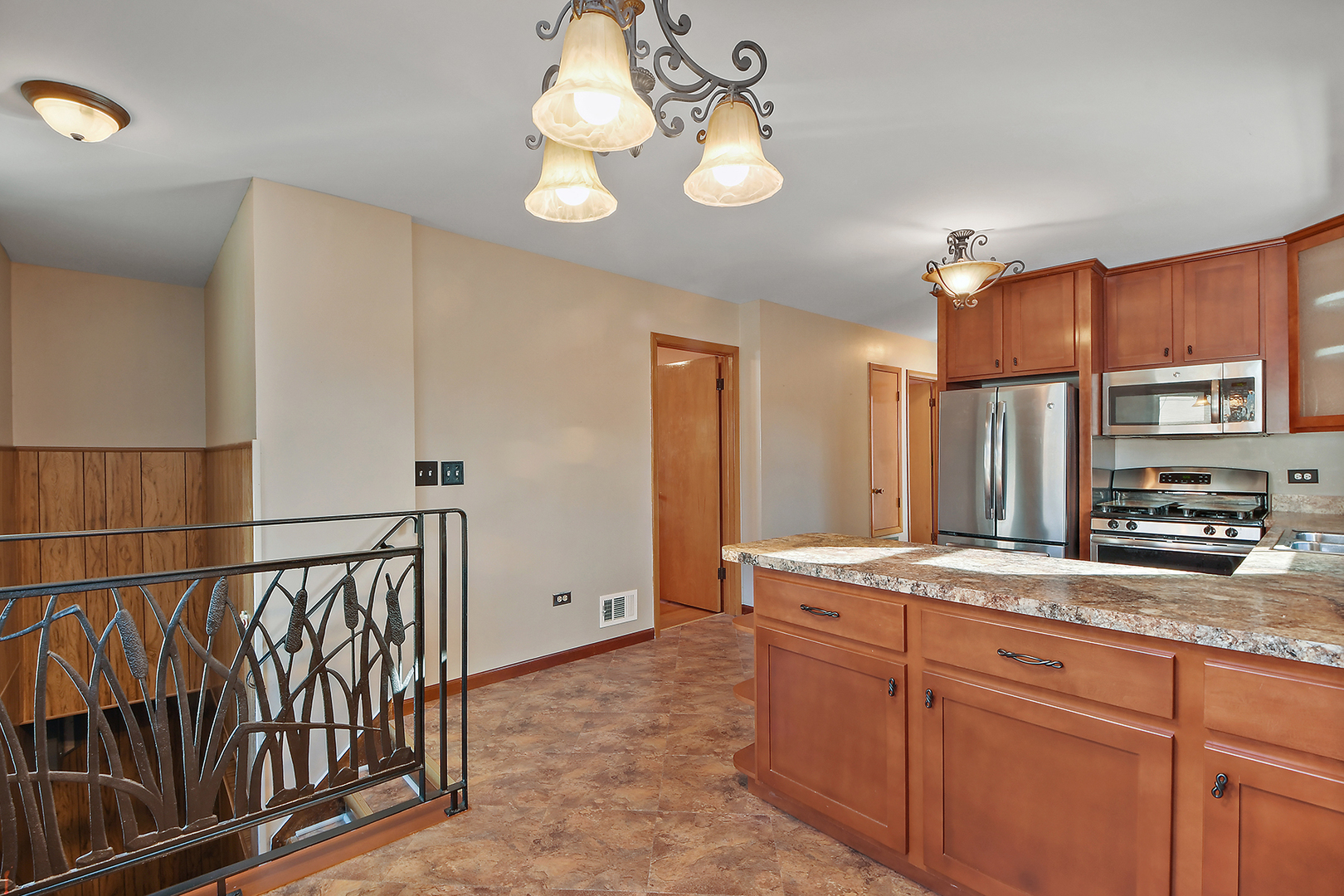 10536 Oak Avenue Chicago Ridge, IL 60415 - Photo 17 of 26 a bathroom with a granite countertop sink a mirror and a shower