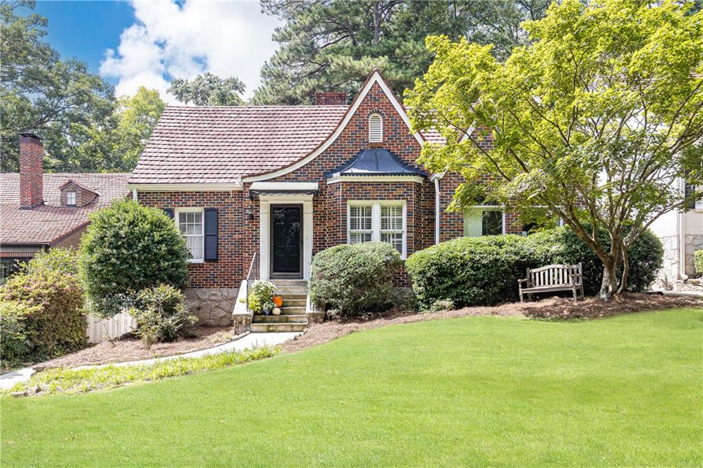 2868 Alpine Road Northeast Atlanta, GA 30305 - Photo 1 of 1 a front view of a house with a yard
