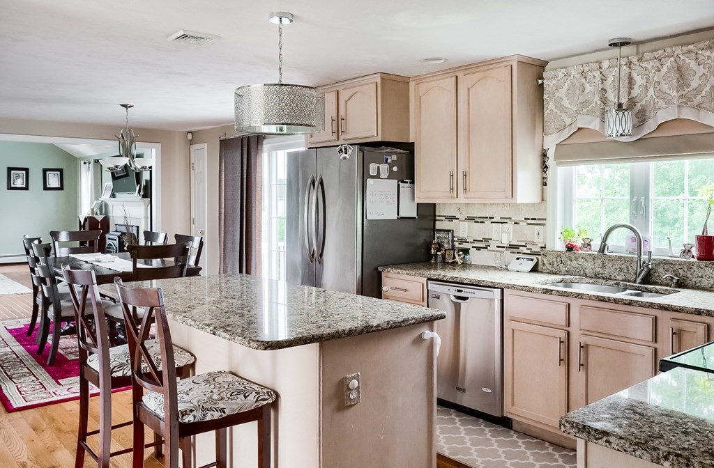 5 Jonathan Circle Rutland, MA 01543 - Photo 7 of 31 a kitchen with stainless steel appliances granite countertop a sink refrigerator and cabinets
