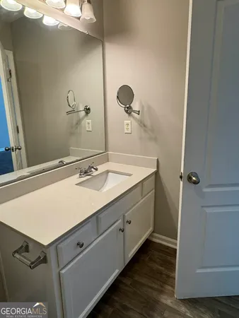 a bathroom with a sink and a mirror
