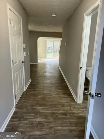 a view of entryway with wooden floor